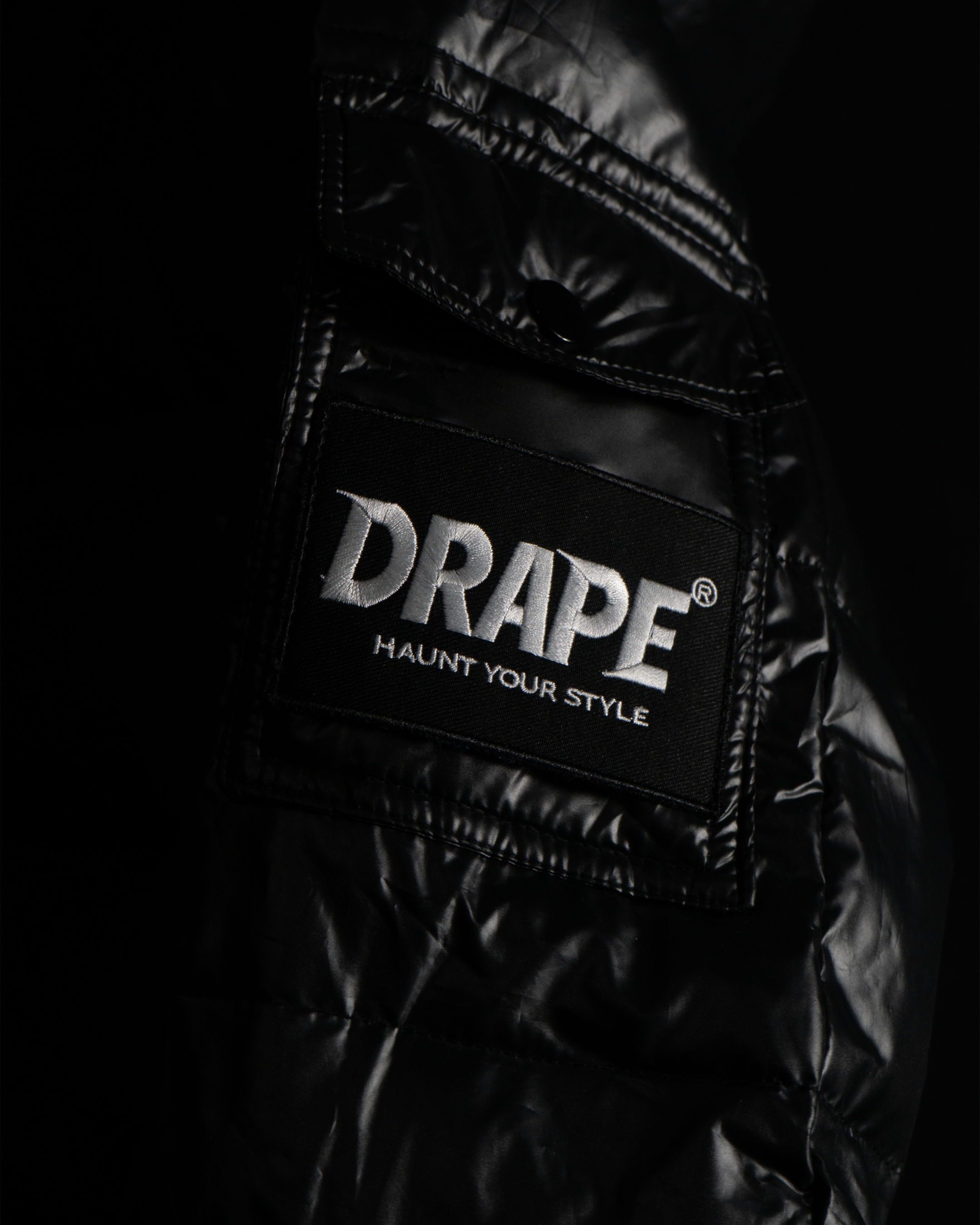 GLOSSY BLACK DRAPE PUFFER